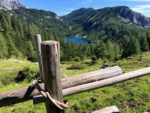 One of the Tauplitzalm lakes seen past an old wooden fence