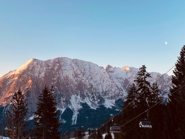 Alpenglow on the Grimming, the moon up, the last chairs going down