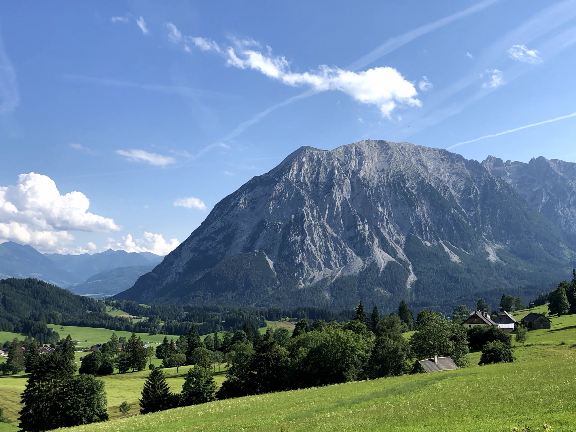 The Grimming rising over the green valley in summer